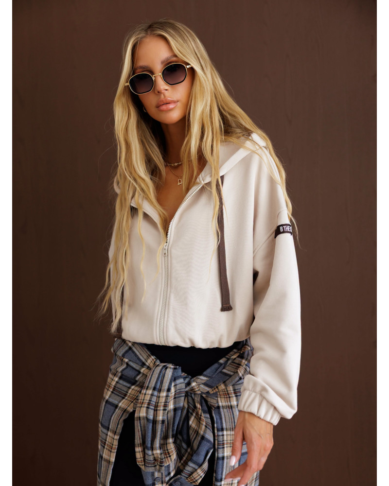 Bluza na zamek z naszywką By o la la...! beżowa