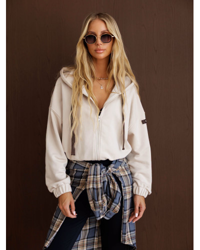 Bluza na zamek z naszywką By o la la...! beżowa